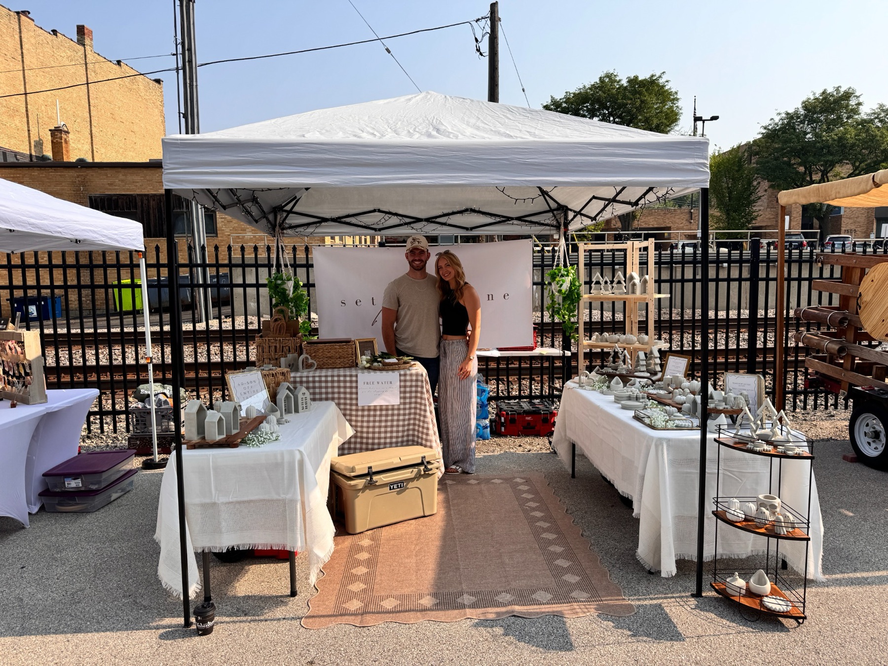 Charles and Tess standing together at the All Set In Stone market booth